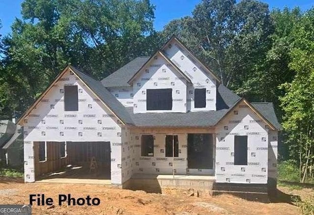 unfinished property with covered porch