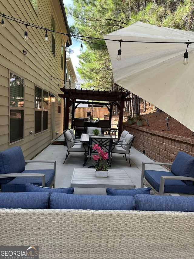 view of patio / terrace with an outdoor living space and a pergola