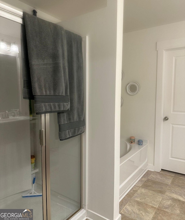 bathroom featuring plus walk in shower