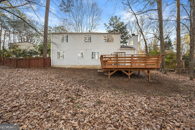 back of property with a deck