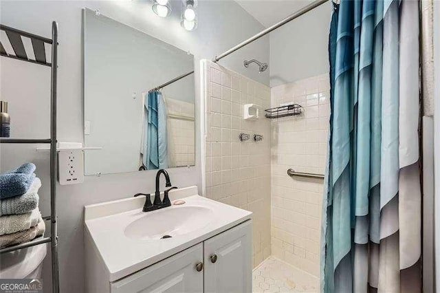 bathroom featuring vanity and walk in shower