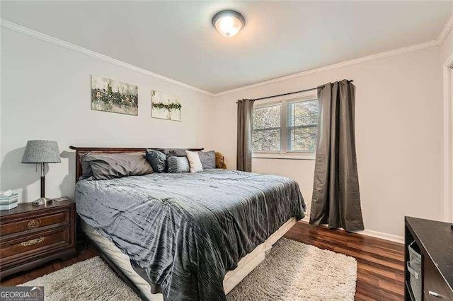 bedroom featuring dark hardwood / wood-style flooring and ornamental molding