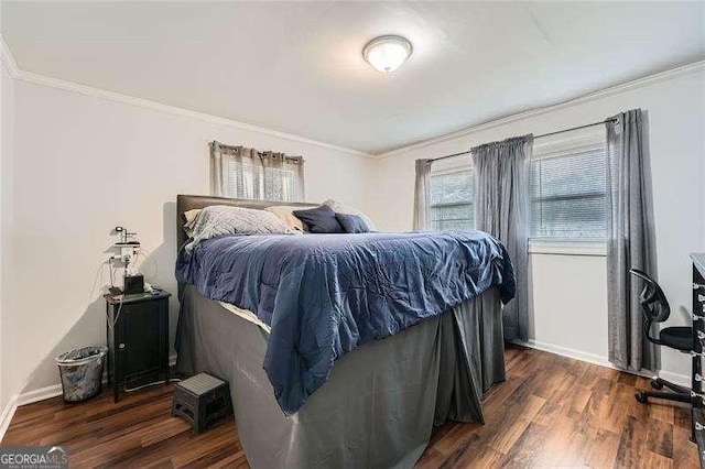 bedroom with dark hardwood / wood-style flooring and ornamental molding