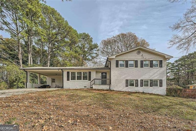 split level home featuring a front yard and a carport