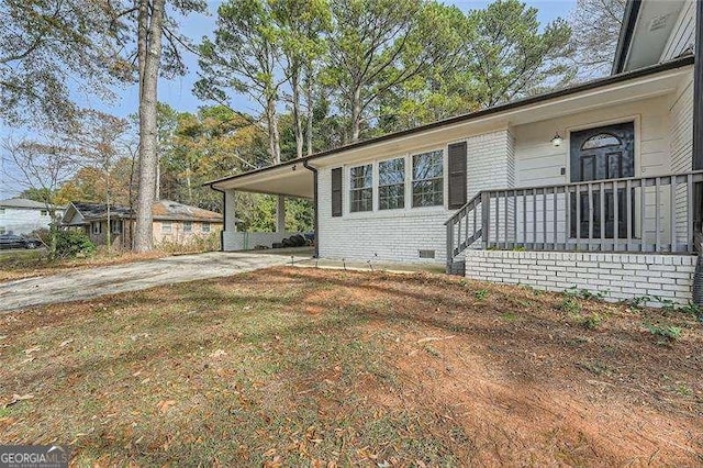 view of home's exterior with a carport