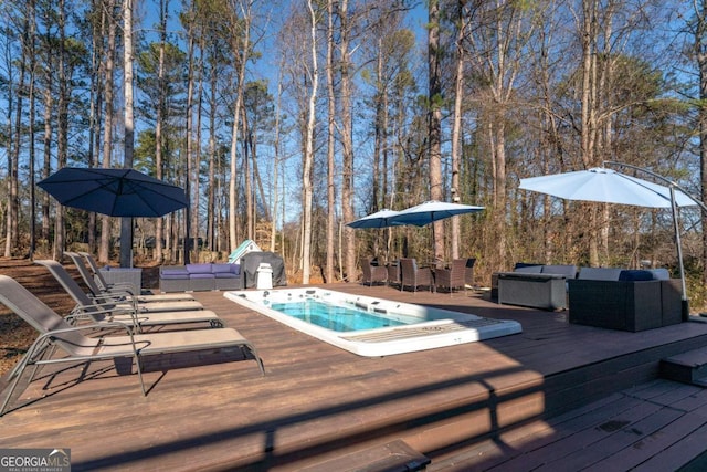 wooden terrace with outdoor lounge area