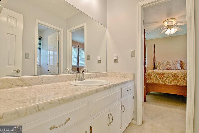 bathroom with vanity and ceiling fan