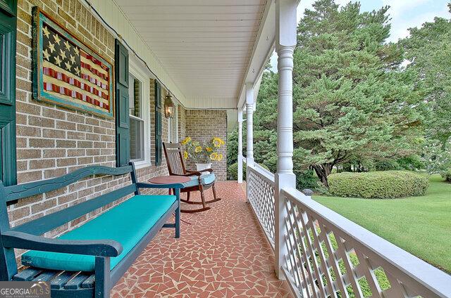 view of patio featuring a porch