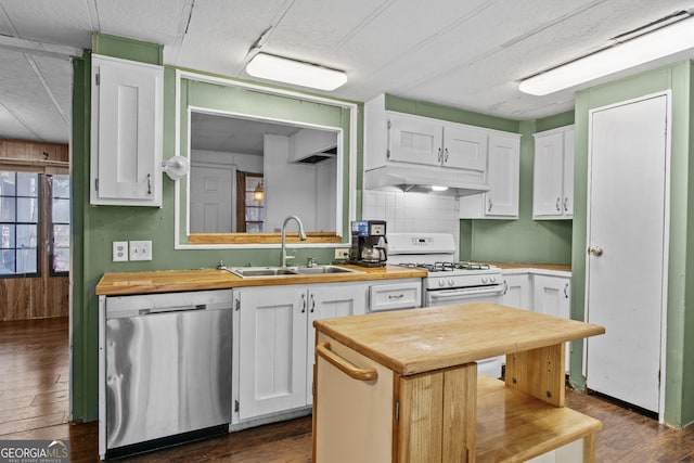 kitchen featuring wooden counters, dark hardwood / wood-style flooring, white cabinets, sink, and dishwasher