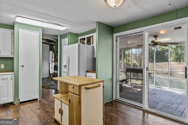 kitchen with wooden counters, white cabinets, dark hardwood / wood-style floors, and white refrigerator with ice dispenser