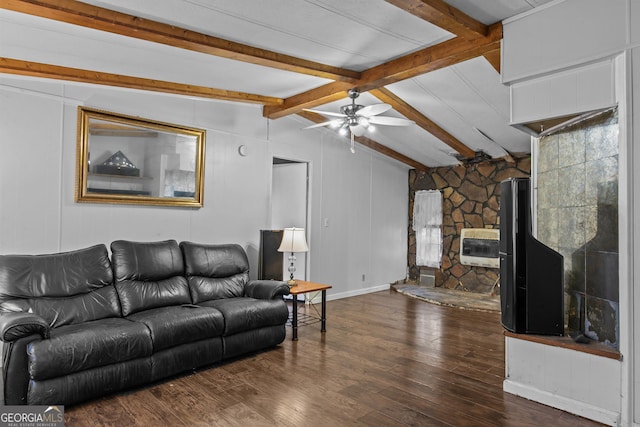 living room with ceiling fan, vaulted ceiling with beams, a stone fireplace, dark hardwood / wood-style flooring, and heating unit