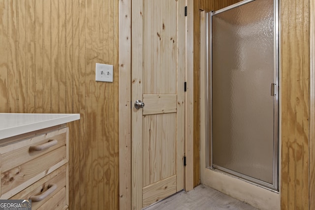 bathroom with a shower with shower door