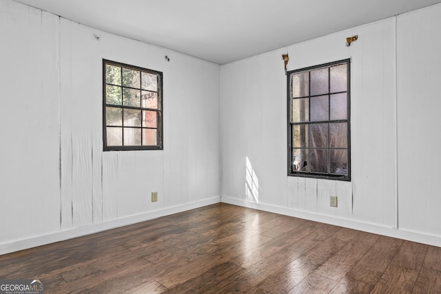 spare room featuring dark hardwood / wood-style floors