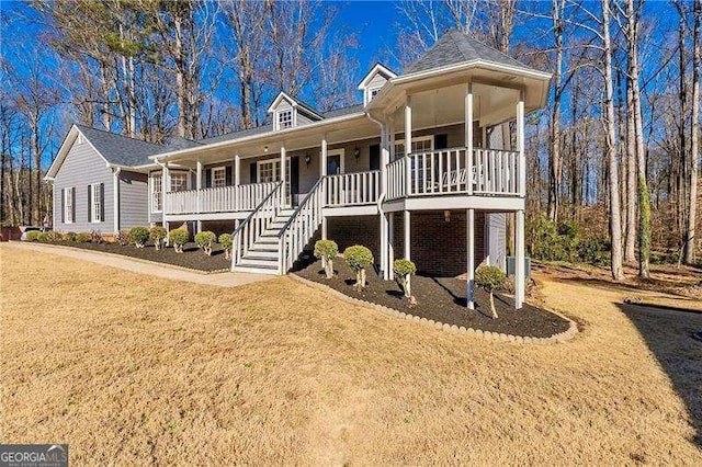 view of front facade with covered porch and a front yard