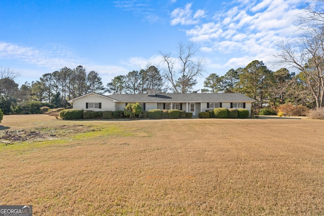 single story home featuring a front lawn