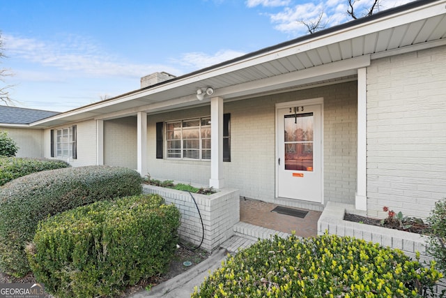 entrance to property with covered porch