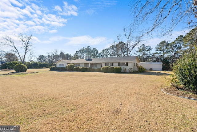 ranch-style home with a front yard