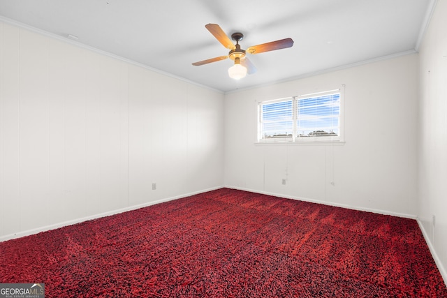 spare room with carpet flooring, ceiling fan, and crown molding