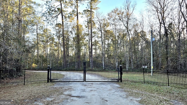 view of gate with a water view