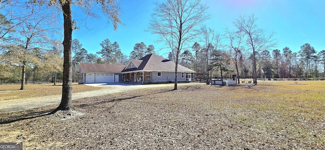 view of property exterior featuring a lawn and a garage