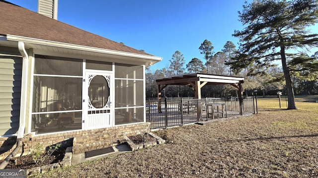 exterior space featuring a sunroom and a gazebo