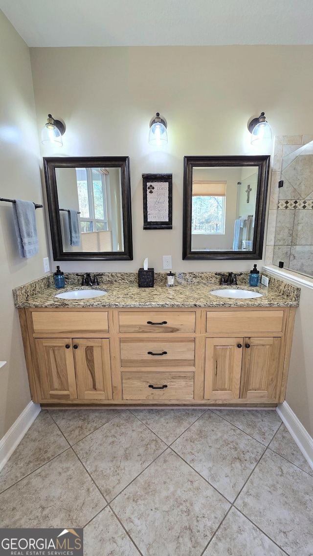 bathroom featuring tile patterned flooring and vanity