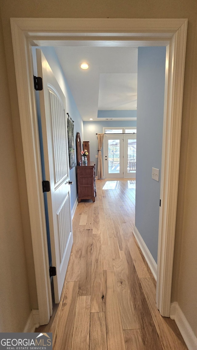 hallway with light wood-type flooring