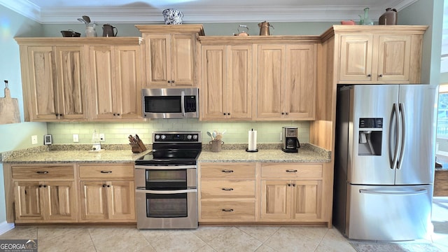 kitchen with light stone countertops, appliances with stainless steel finishes, backsplash, and light tile patterned flooring