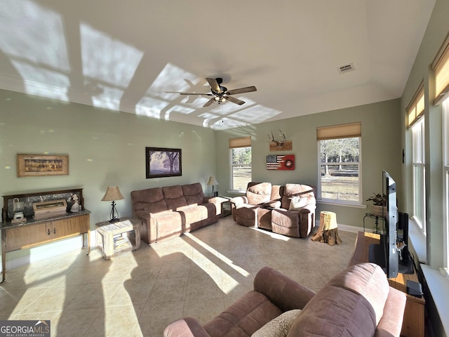 living room featuring ceiling fan and light tile patterned floors