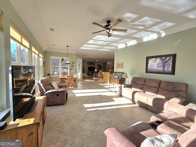 tiled living room featuring ceiling fan and crown molding