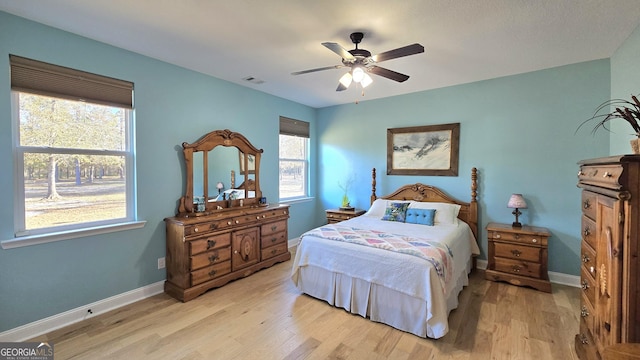 bedroom featuring ceiling fan and light hardwood / wood-style floors