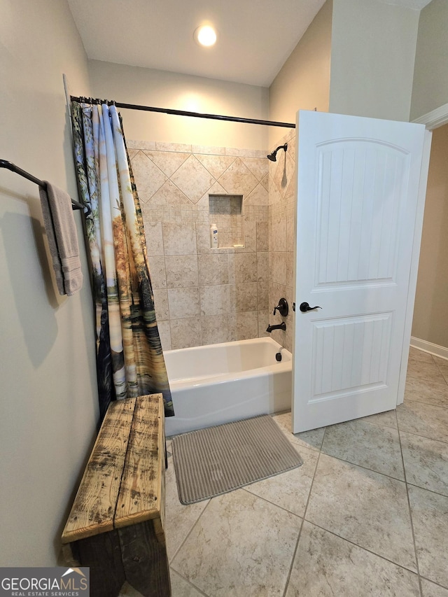 bathroom featuring tile patterned flooring and shower / bath combination with curtain