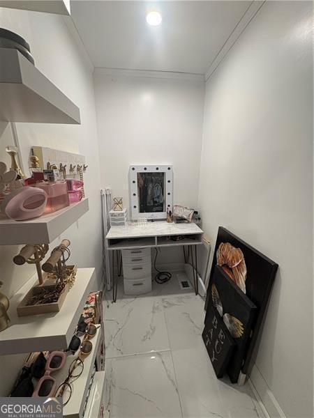 bathroom featuring ornamental molding