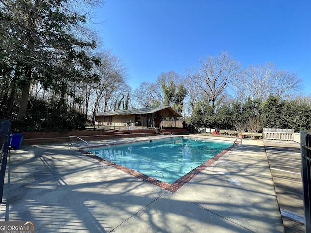 view of swimming pool with a patio area