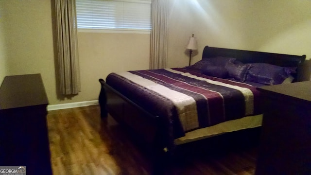 bedroom with wood-type flooring