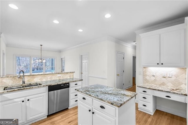 kitchen featuring white cabinetry, dishwasher, a center island, sink, and decorative light fixtures