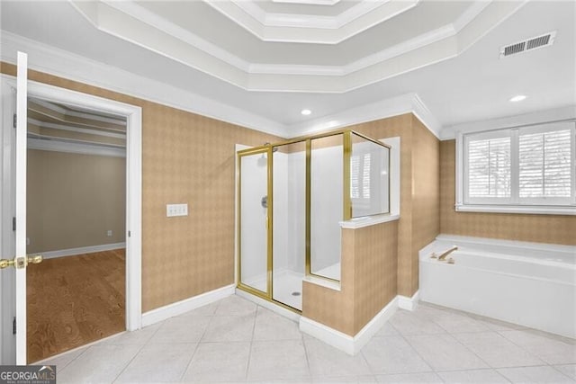 bathroom featuring tile patterned floors, a tray ceiling, independent shower and bath, and ornamental molding