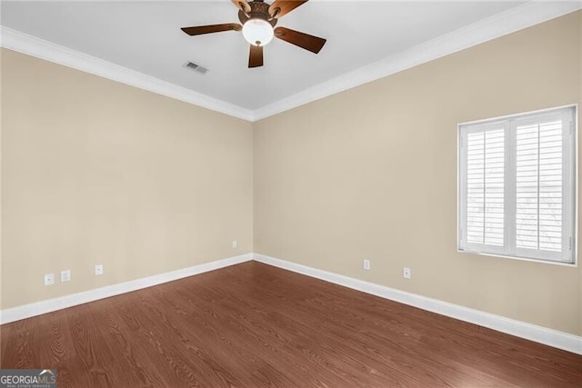 unfurnished room featuring hardwood / wood-style flooring, ceiling fan, and ornamental molding