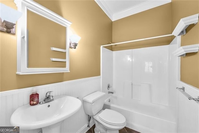 full bathroom featuring toilet, crown molding, sink, and bathtub / shower combination