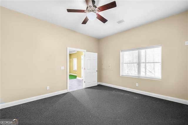 empty room featuring ceiling fan