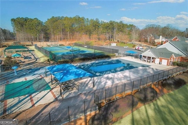 view of pool with tennis court