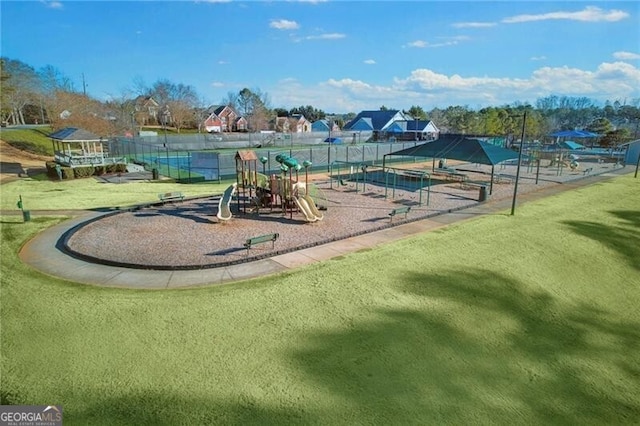 view of jungle gym with a lawn