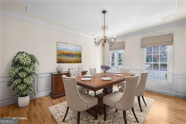 dining room featuring a chandelier and light hardwood / wood-style floors