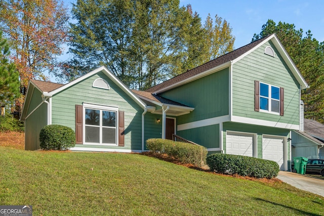 view of front of house with a front lawn and a garage