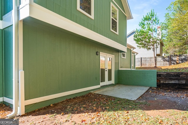 view of side of property with a patio area and french doors