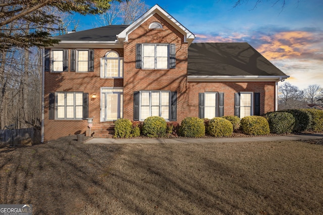 view of front of property with a lawn