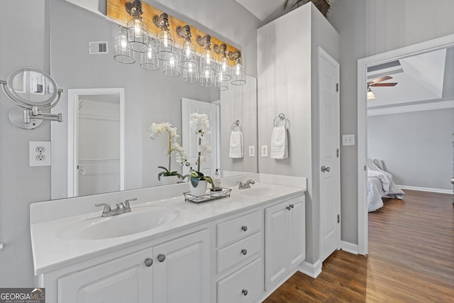 bathroom featuring ceiling fan, wood-type flooring, and vanity