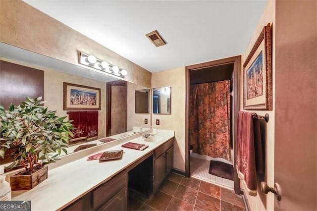 bathroom with vanity and walk in shower