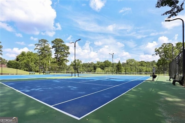 view of sport court featuring basketball hoop