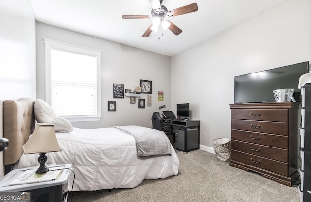 bedroom with light colored carpet and ceiling fan